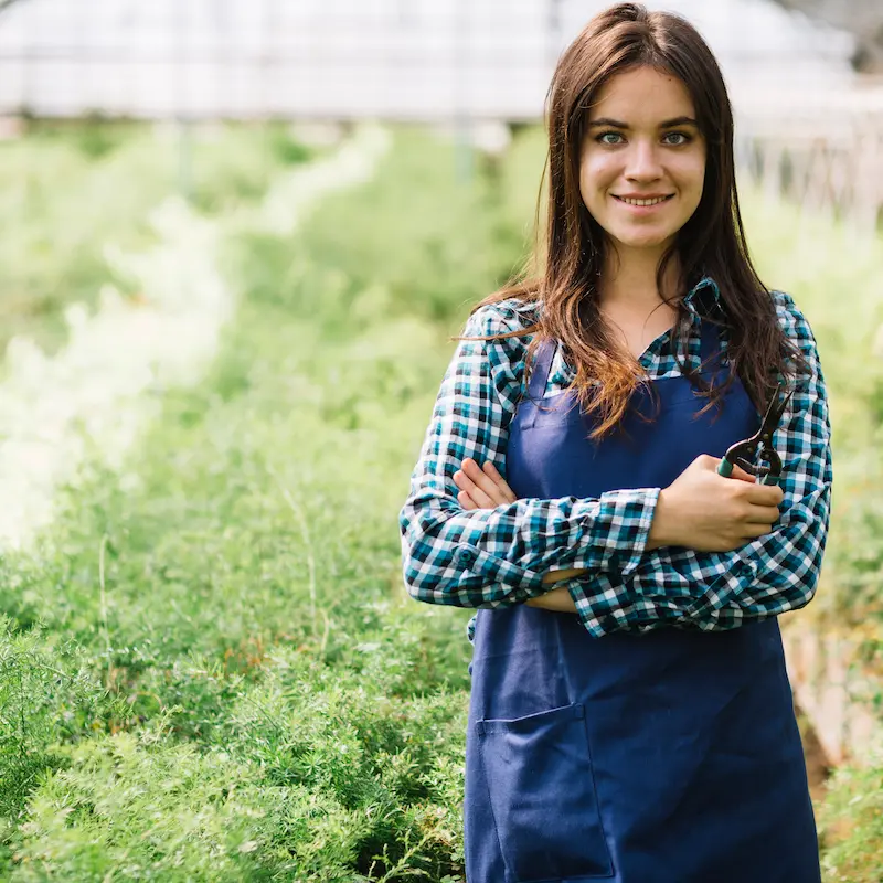 young-female-gardener-greenhouse